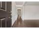 Inviting hallway features hardwood floors, archways, fresh paint and decorative wall trim at 104 Marlow Dr, Woodstock, GA 30188