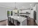 Open concept kitchen with island seating, stainless appliances, and lots of natural light at 104 Marlow Dr, Woodstock, GA 30188