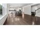 Open concept living room and kitchen featuring hardwood floors and breakfast bar at 104 Marlow Dr, Woodstock, GA 30188