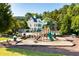 Community playground featuring modern equipment, a soft landing surface, and a nearby pool area, perfect for Gathering fun at 104 Marlow Dr, Woodstock, GA 30188