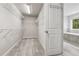 Walk-in closet featuring overhead lighting and wire shelving units at 104 Marlow Dr, Woodstock, GA 30188