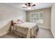 Cozy bedroom with neutral tones, plush carpeting, and window with views of the outdoor landscape at 1058 Magnolia Dr, Villa Rica, GA 30180