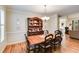 Formal dining room with hardwood floors, wainscoting, and elegant chandelier at 1058 Magnolia Dr, Villa Rica, GA 30180