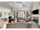 Spacious living room featuring a stone fireplace, vaulted ceilings, and hardwood floors at 1058 Magnolia Dr, Villa Rica, GA 30180