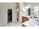 Large bathroom with dual sinks, a walk-in closet, and separate toilet room at 1058 Magnolia Dr, Villa Rica, GA 30180