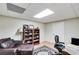 Comfortable office space with a leather chair, a bookshelf, and a work desk, ideal for productivity at 1058 Magnolia Dr, Villa Rica, GA 30180