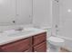 Clean bathroom featuring a vanity, toilet, and shower/tub combo at 5589 Dendy Trc, Fairburn, GA 30213