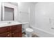 Bathroom with a white vanity, toilet, and tub-shower combination at 5589 Dendy Trc, Fairburn, GA 30213
