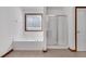 Bathroom with tiled floor featuring a shower and a tub beneath a window at 5589 Dendy Trc, Fairburn, GA 30213