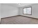 Cozy bedroom with carpet flooring and a window providing natural light at 5589 Dendy Trc, Fairburn, GA 30213