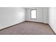 Bedroom with carpet flooring and a window providing natural light at 5589 Dendy Trc, Fairburn, GA 30213