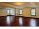 Large bonus room with hardwood flooring and neutral walls, perfect for entertaining at 5589 Dendy Trc, Fairburn, GA 30213