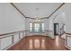 Elegant dining space with hardwood floors, wainscoting, and a bay window at 5589 Dendy Trc, Fairburn, GA 30213