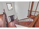 Elegant entryway featuring wood floors and a staircase with decorative metal accents at 5589 Dendy Trc, Fairburn, GA 30213