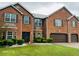 Charming two-story brick home with well-manicured lawn and mature landscaping at 5589 Dendy Trc, Fairburn, GA 30213