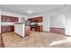Spacious kitchen with stainless steel appliances, granite countertops, and tile flooring at 5589 Dendy Trc, Fairburn, GA 30213