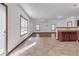 Inviting living area showcasing tile floors and a built-in kitchenette at 5589 Dendy Trc, Fairburn, GA 30213