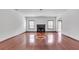 Open living area with hardwood floors, fireplace, and views of the backyard at 5589 Dendy Trc, Fairburn, GA 30213