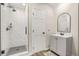 Modern bathroom with walk-in shower, white subway tile, and sleek vanity at 750 Southland Pass, Stone Mountain, GA 30087