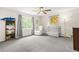 This Bedroom offers light gray carpet and a light gray ceiling fan at 750 Southland Pass, Stone Mountain, GA 30087