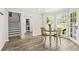 Bright dining area featuring large windows and access to stairs and laundry at 750 Southland Pass, Stone Mountain, GA 30087