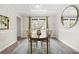 Elegant dining room with classic decor, a patterned rug, and large windows at 750 Southland Pass, Stone Mountain, GA 30087