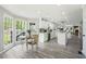 Open-concept kitchen and dining area with stainless appliances and an abundance of natural light at 750 Southland Pass, Stone Mountain, GA 30087