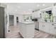 Bright kitchen featuring a large island, stainless steel appliances, and ample white cabinetry at 750 Southland Pass, Stone Mountain, GA 30087