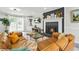 Cozy living room featuring a fireplace, built-in shelving, and large windows for natural light at 750 Southland Pass, Stone Mountain, GA 30087