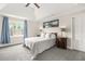 Spacious main bedroom offering tray ceilings, gray carpet, and plenty of natural light at 750 Southland Pass, Stone Mountain, GA 30087