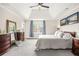 Spacious main bedroom with carpet and a tray ceiling at 750 Southland Pass, Stone Mountain, GA 30087