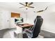 A home office features gray carpet and a desk for a functional workspace at 750 Southland Pass, Stone Mountain, GA 30087