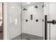 Modern tile shower features dual shower heads, a niche, and glass enclosure at 750 Southland Pass, Stone Mountain, GA 30087