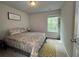 Bedroom with queen bed, carpet, natural light, and neutral walls at 2333 Castle Keep Way, Atlanta, GA 30316
