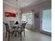 Charming dining area with modern chandelier, glass-top table, and ample natural light at 2333 Castle Keep Way, Atlanta, GA 30316