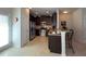 Contemporary kitchen with stainless appliances, dark cabinets, and tile flooring at 2333 Castle Keep Way, Atlanta, GA 30316