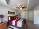 Main bedroom with tray ceiling, carpet, and neutral paint at 2333 Castle Keep Way, Atlanta, GA 30316
