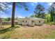 Exterior view of backyard featuring white brick and a small, fenced patio at 2461 Antwerp Se Dr, Atlanta, GA 30315
