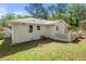 Exterior view of backyard featuring white brick and a small, fenced patio at 2461 Antwerp Se Dr, Atlanta, GA 30315