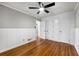 Bedroom featuring hardwood floors and decorative wainscotting at 2461 Antwerp Se Dr, Atlanta, GA 30315