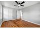 Bedroom with hardwood floors, ceiling fan, and double closet doors at 2461 Antwerp Se Dr, Atlanta, GA 30315