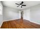 Bedroom with hardwood floors, a ceiling fan, and a double-door closet at 2461 Antwerp Se Dr, Atlanta, GA 30315