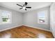 Bedroom featuring hardwood floors, ceiling fan, and windows for plenty of natural light at 2461 Antwerp Se Dr, Atlanta, GA 30315