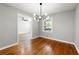 Dining room with modern lighting, hardwood floors and access to another room at 2461 Antwerp Se Dr, Atlanta, GA 30315