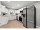 Modern kitchen featuring stainless steel appliances, white cabinets, and elegant marble countertops at 2461 Antwerp Se Dr, Atlanta, GA 30315