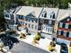 Aerial view of brick townhomes with two-car garages at 2928 Wintercrest Way, Atlanta, GA 30360