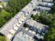Aerial view showcasing a well-maintained neighborhood with lush green trees, sidewalks, and diverse home styles at 2928 Wintercrest Way, Atlanta, GA 30360