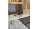 Bathroom featuring a double sink vanity and marble tile shower in mirror's reflection at 4487 Park Place Ter, Marietta, GA 30066