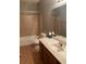 Bathroom with a tiled shower/tub combo, a toilet, and a vanity at 4487 Park Place Ter, Marietta, GA 30066