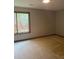 Carpeted bedroom offers natural light through the window at 4487 Park Place Ter, Marietta, GA 30066
